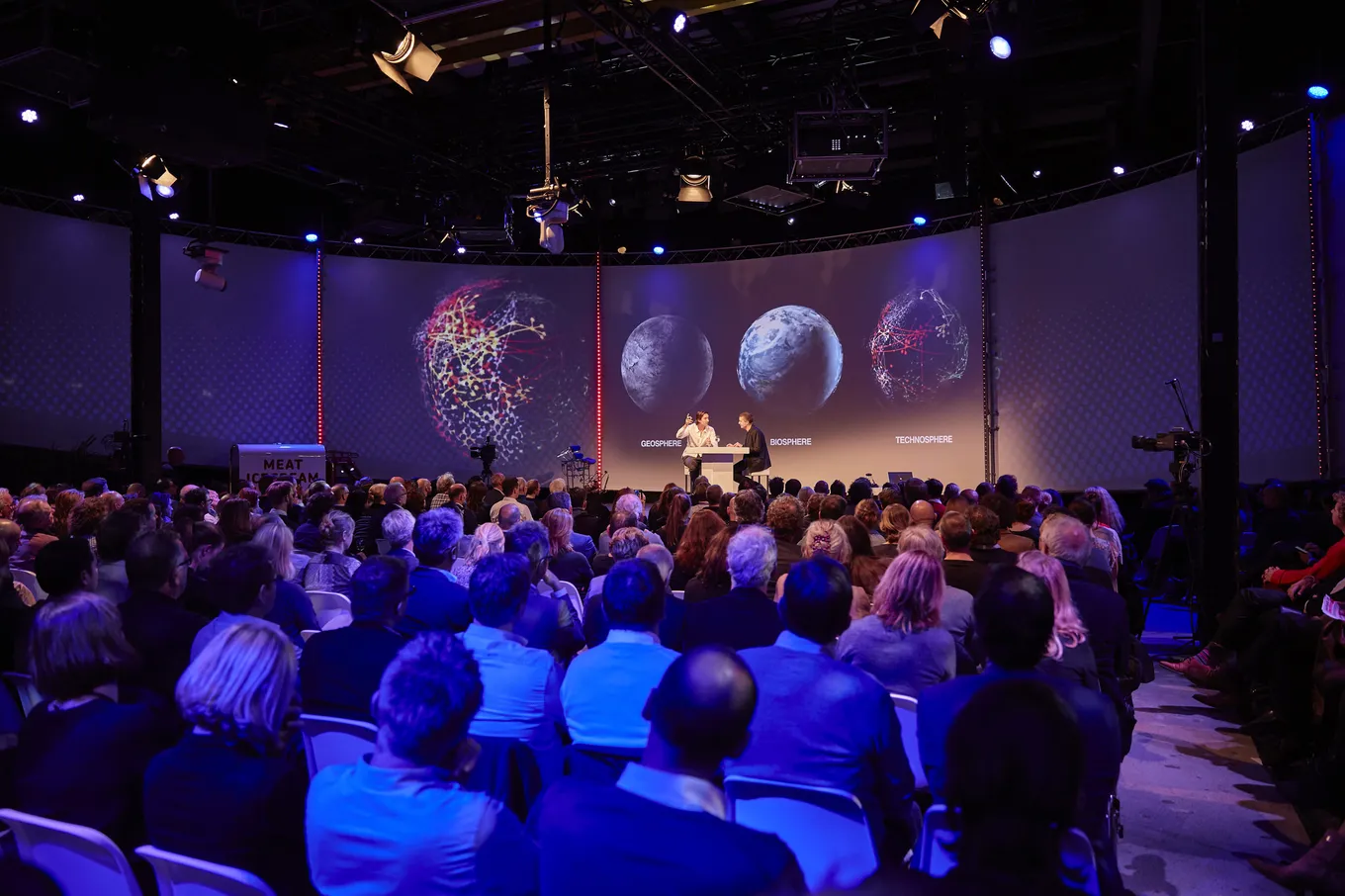 Audience in the central dome of the Evoluon during a presentation
